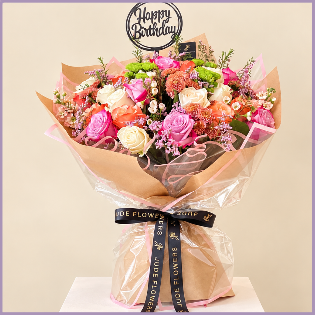 Birthday Garden bouquet of purple, white and orange roses with birthday topper – Jude Flowers Bahrain