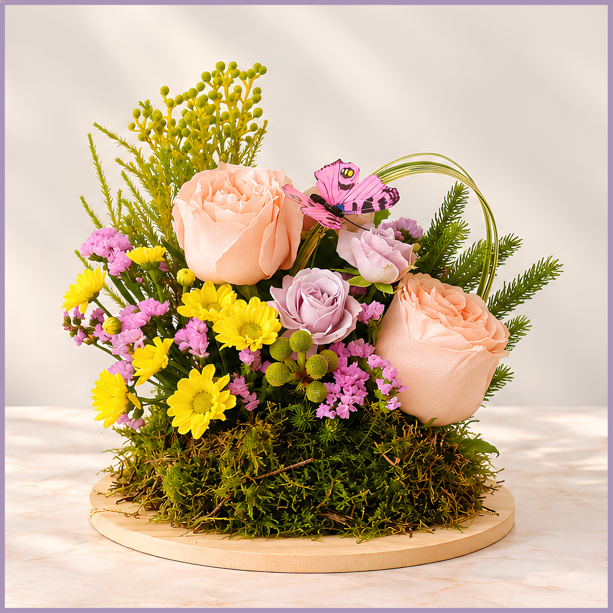 Petite Bliss pink rose and santini floral arrangement on a moss base with decorative butterfly – Jude Flowers Bahrain