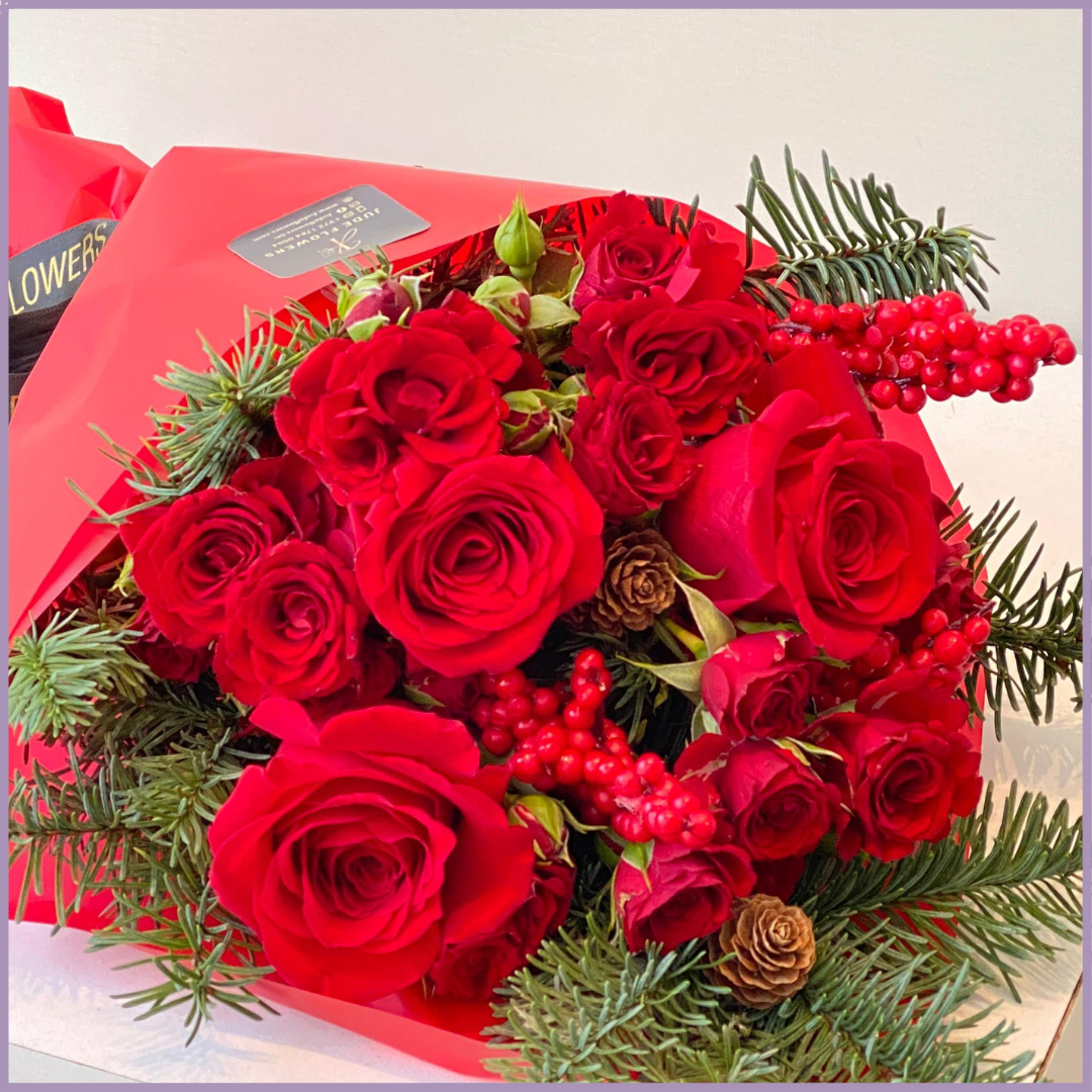 Red Christmas Hand Bouquet – Festive Roses & Fir