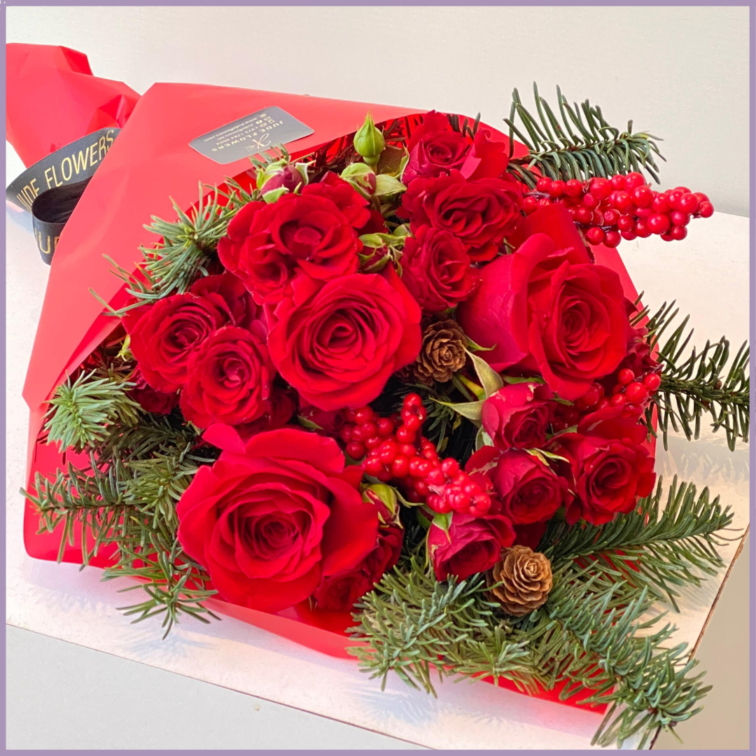 Red Christmas Hand Bouquet – Festive Roses & Fir