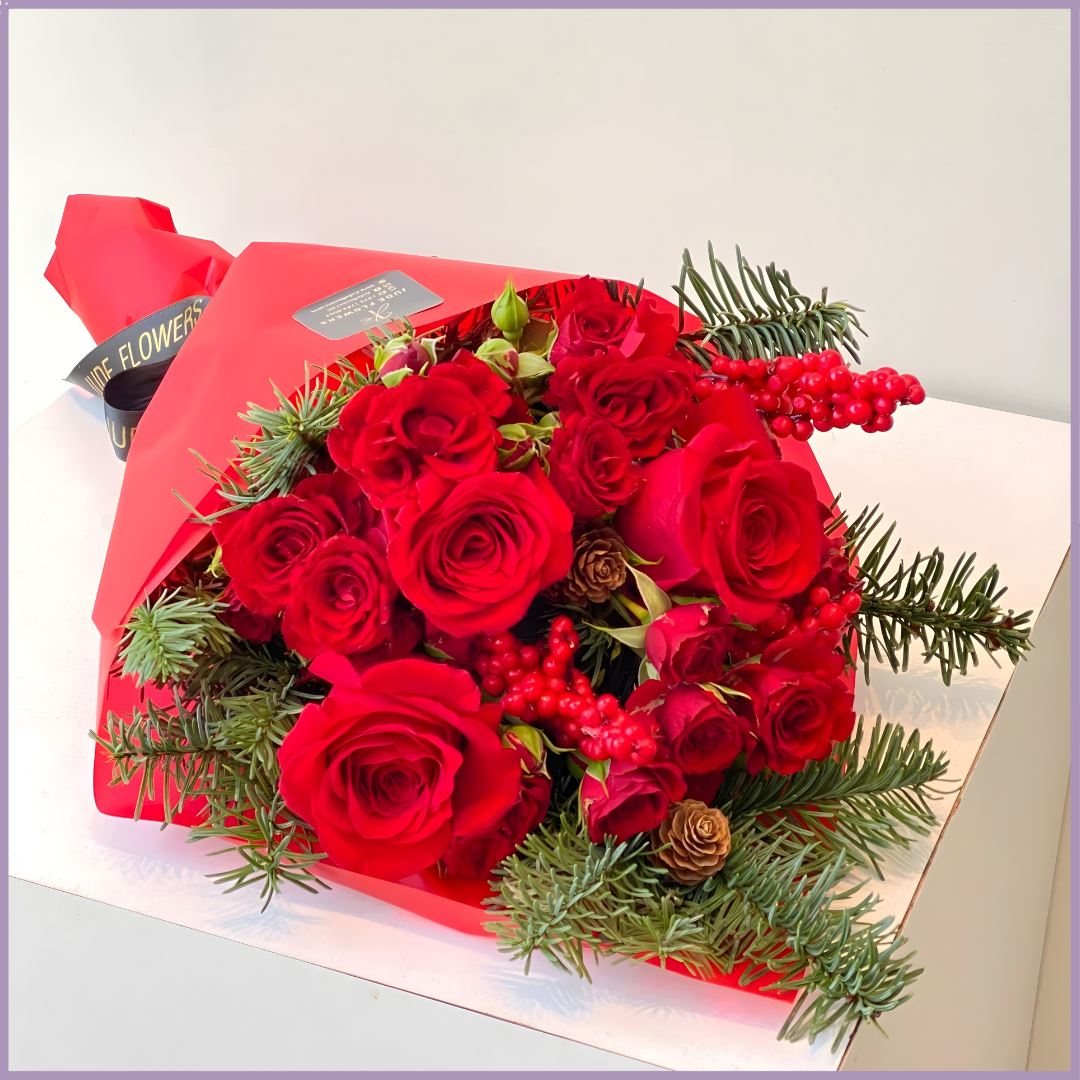 Red Christmas Hand Bouquet – Festive Roses & Fir