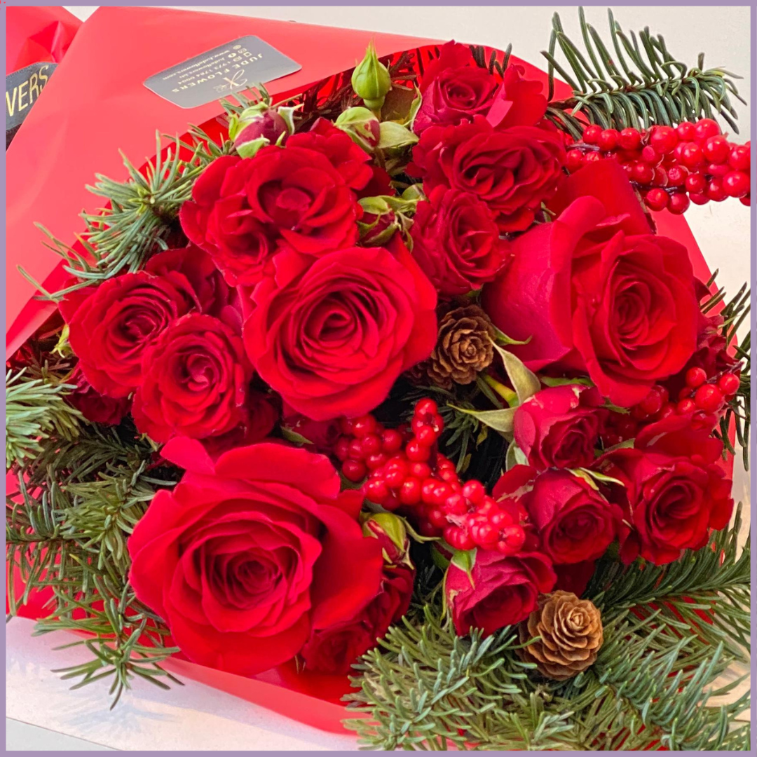 Red Christmas Hand Bouquet – Festive Roses & Fir